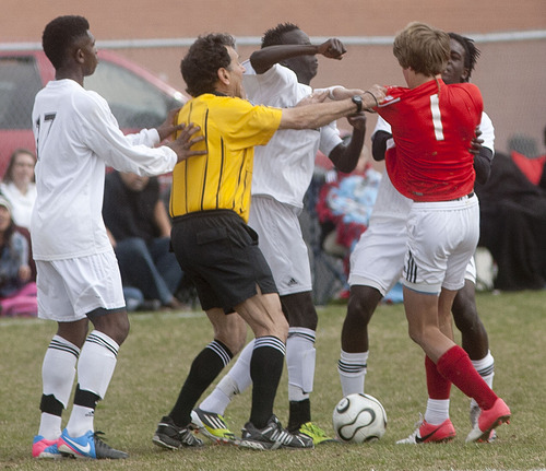 Steve Griffin | The Salt Lake Tribune

The ref steps between Highland's Daniel Akok and East's Landon Carlson to break up a fight during second half action during game between at Highland High School in Salt Lake City, Utah Friday April 19, 2013. Both players were ejected from the game.