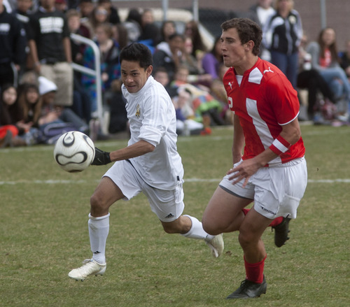 Steve Griffin | The Salt Lake Tribune

East's Zach Swenson, right,  and Highlands Juan Rios chase down the ball during soccer game between East and Highland at Highland High School in Salt Lake City, Utah Friday April 19, 2013.