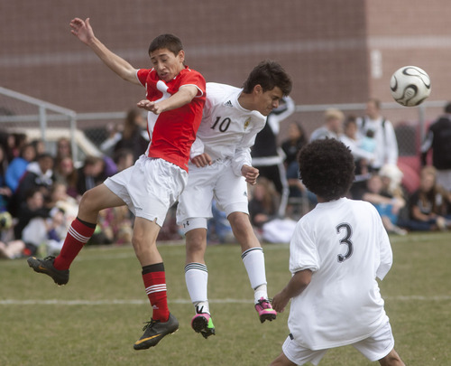 Steve Griffin | The Salt Lake Tribune

Highland's Carlos Mardoniz heads the ball away from East's Hugo Olivera during second half action of game at Highland High School in Salt Lake City, Utah Friday April 19, 2013.