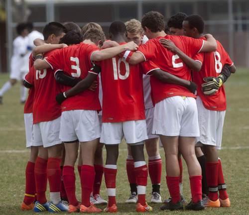 Steve Griffin | The Salt Lake Tribune

East players huddle together at the start of the second half of soccer game between East and Highland at Highland High School in Salt Lake City, Utah Friday April 19, 2013.