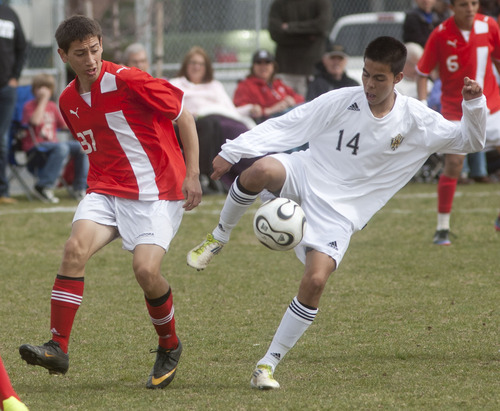 Steve Griffin | The Salt Lake Tribune

Highland's Luis Orozco, right,  keeps the ball away from East's Hugo Olivera  during game at Highland High School in Salt Lake City, Utah Friday April 19, 2013.