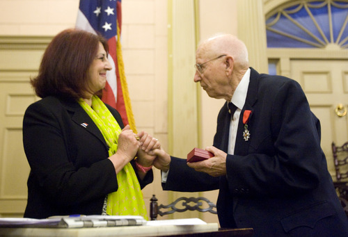 Kim Raff  |  The Salt Lake Tribune
Mike Kladis, 91, is awarded the Legion of Honour, for his service in the Army liberating France during World War II, by (left) Marie-Helene Glon, of the Honorary Consul of France, at the Masonic Lodge in Salt Lake City on April 20, 2013.  This award is France's highest honor.