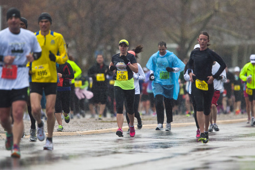 Chris Detrick  |  The Salt Lake Tribune
Runners race along 2100 south near Sugar House Park during the Salt Lake City marathon and half marathon Saturday April 20, 2013.