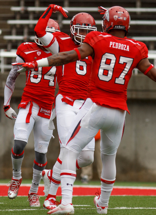 Trent Nelson  |  The Salt Lake Tribune
Dres Anderson celebrates a long reception with teammate Quinton Pedroza (87) during the University of Utah's Red-White Spring football game, Saturday April 20, 2013 in Salt Lake City.