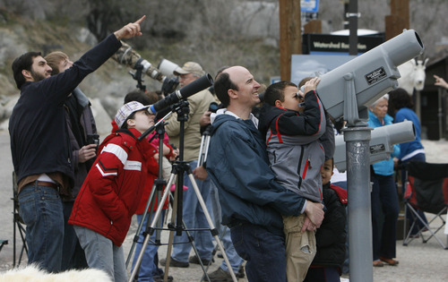 Francisco Kjolseth  |  Tribune file photo
Steve Fitzpatrick of Sandy holds up his son Tommy while James waits his turn at the scope as they spot mountain goats at the base of Little Cottonwood Canyon in 2011. The Utah Division of Wildlife Services is once again inviting the public to observe mountain goats using provided binoculars and spotting scopes. This year's viewing party is April 20, 2013. 

Steve Fitzpatrick of Sandy holds up his son Tommy, 6, while James, 4, waits his turn at the scope as they spot Mountain Goats at the base of Little Cottonwood Canyon. The Utah Division of Wildlife Services invited the public to observe mountain goats using provided binoculars and spotting scopes. Bob Walters, Watchable Wildlife coordinator for the Division of Wildlife Resources, says April is one of the best months to see the goats.