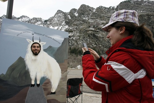 Francisco Kjolseth  |  The Salt Lake Tribune
Biology student Brandon Riches mugs for a picture by his wife Chelsea during a mountain goat spotting event at the base of Little Cottonwood Canyon in 2011. The Utah Division of Wildlife Services is once again inviting the public to observe mountain goats using provided binoculars and spotting scopes. This year's viewing party is April 20, 2013.
