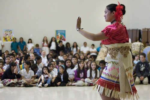 Paul Fraughton  |   Salt Lake Tribune
 Siutaisa Vaitai performs the Tauolunga, a traditional Tongan dance,  as part of the festivities at The Pacific Heritage Academy's Tongan Heritage Day Celebration held at the school.                                                 
 Friday, April 19, 2013
