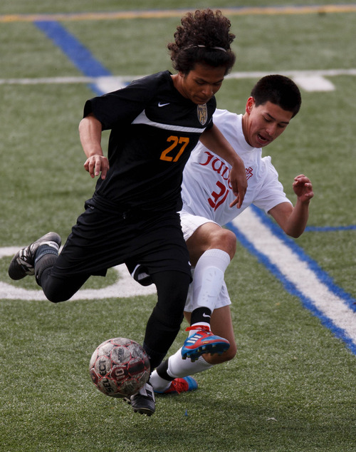 Trent Nelson  |  The Salt Lake Tribune
Wasatch's Alex Espinoza dribbles with Judge's Jose Batalla defending as Wasatch faces Judge Memorial High School, boys soccer Wednesday April 17, 2013 in Salt Lake City.