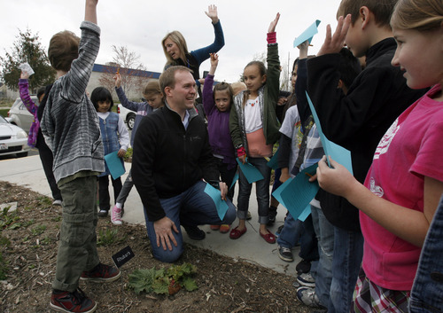 Francisco Kjolseth  |  The Salt Lake Tribune
Salt Lake County Mayor McAdams asks "Who likes pie?" as he joins Parkside Elementary school kids to talk about rhubarb and other fruits and vegetables being grown at the SLCoHD Environmental Health Division in Murray. The Salt Lake County Health Department held its 4th Annual Earth Day Festival, where students from elementary schools near the Environmental Health Division offices were invited to learn about sustainability and environmentally friendly practices, as well as about what the EH division does in Salt Lake County.