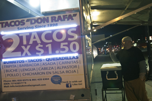 Chris Detrick  |  The Salt Lake Tribune
Rob Perkins, sous chef at Franck's Restaurant, orders carnitas and lengua tacos at Tacos "Don Rafa" cart near 750 S. State St. in Salt Lake City on Thursday April 11, 2013.