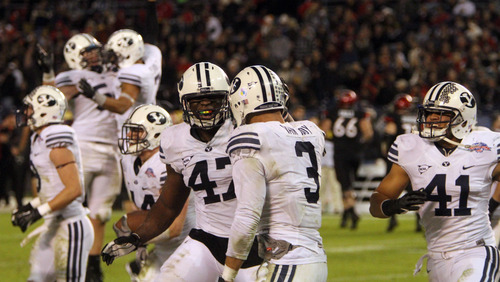 Rick Egan  | The Salt Lake Tribune 

 Brigham Young Cougars linebacker Ezekiel Ansah (47) and Brigham Young Cougars linebacker Uani Unga (41) celebrate with Brigham Young linebacker Kyle Van Noy (3) celebrates after scoring his second touchdown of the night for the cougars, as BYU defeated San Diego State 23-6 in the Poinsettia Bowl, Thursday, December 20, 2012.
