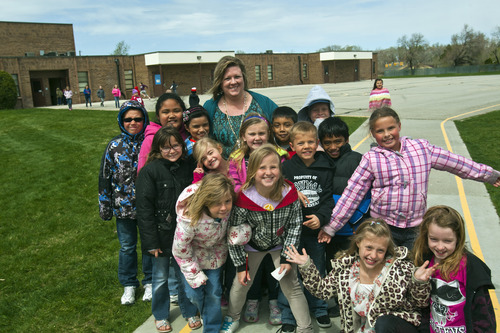 Chris Detrick  |  The Salt Lake Tribune
Principal Christine Christensen poses for a portrait with some of the students at Truman Elementary in West Valley City.