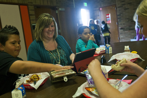 Chris Detrick  |  The Salt Lake Tribune
Principal Christine Christensen eats lunch with students Anthony Wiseman, Aubre Cooper and Maranda Porten at Truman Elementary in West Valley City.