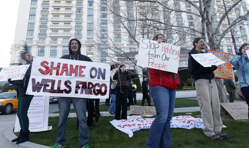 Al Hartmann  |  The Salt Lake Tribune
About 40 protesters, many from the San Francisco-area and associated with ACCE (Alliance of Californians for Community Empowerment), protest in front of The Grand America Hotel in Salt Lake City on Tuesday, April 23, where Wells Fargo is holding its annual meeting. The bank is based in San Francisco. The last two meetings in San Francisco were disrupted by protesters angry at the bank's mortgage foreclosure policies.
