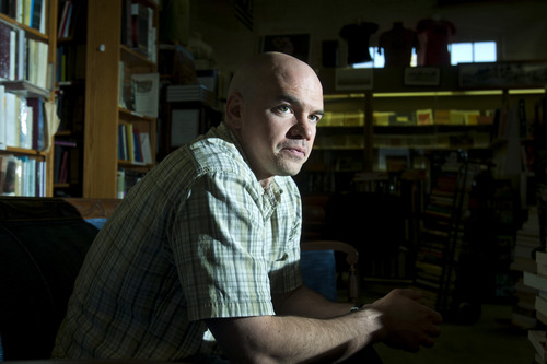 Chris Detrick  |  The Salt Lake Tribune
Tim DeChristopher works at Ken Sanders Rare Books Tuesday April 23, 2013. DeChristopher was released just Sunday from his 21-month term for fraudulently bidding on public land leases at a 2008 Bureau of Land Management oil and gas auction. He had hoped to prevent drilling on sensitive land.