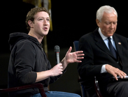 Al Hartmann   |  Tribune file photo
 
Facebook founder Mark Zuckerberg, left, is targeting Utah Sen. Orrin Hatch with advertising supporting immigration reform. They are seen here at a BYU technology forum in March 2011.