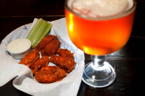 Trent Nelson  |  The Salt Lake Tribune
Buffalo Wings and a schooner of beer at Spedelli's, a Salt Lake City Pizza Parlor and bar, Wednesday April 10, 2013.