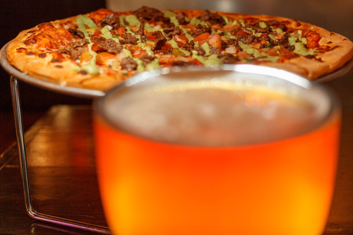 Trent Nelson  |  The Salt Lake Tribune
The carne asada pizza and a schooner of beer at Spedelli's, a Salt Lake City Pizza Parlor and bar, Wednesday April 10, 2013.