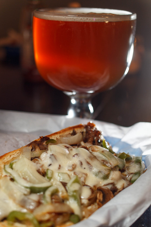 Trent Nelson  |  The Salt Lake Tribune
The Philly Cheesesteak sandwich with a schooner of beer at Spedelli's, a Salt Lake City Pizza Parlor and bar, Wednesday April 10, 2013.