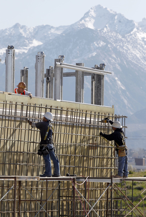 Al Hartmann  |  The Salt Lake Tribune
Construction workers work on the penguin house  Wednesday April 23 at The Living Planet Aquarium at 12033 South Lone Peak Parkway in Draper. The 100,000-square-foot structure is beginning to take shape.
