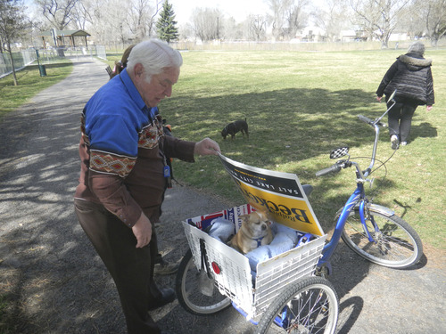 Tom Wharton  |  The Salt Lake Tribune
Earl Close of Salt Lake City takes his pooch for a ride in the back of his bike for a near daily visit to the Cottonwood Park off-leash area.