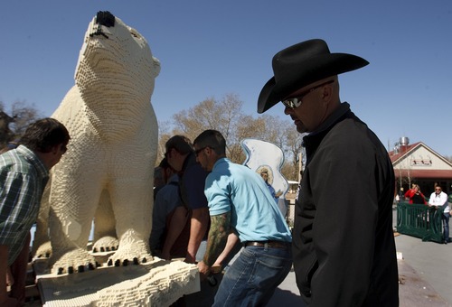 Leah Hogsten  |  The Salt Lake Tribune
Brandon Vierig and fellow Hogle Zoo employees move the polar bear to its display. Lego artist Sean Kenney used more than 259,000 Lego pieces to build 30 animals including monkeys, snakes, birds, frogs, turtles and a polar bear now on display at Hogle Zoo. Kenney hopes the exhibit will teach people about disappearing habitats.
