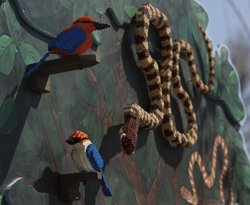 Leah Hogsten  |  The Salt Lake Tribune
Lego snakes and tropical birds at the Hogle Zoo. Lego artist Sean Kenney used more than 259,000 Lego pieces to build 30 animals including monkeys, snakes, birds, frogs, turtles and a polar bear now on display at Hogle Zoo. Kenney hopes the exhibit will teach people about disappearing habitats.