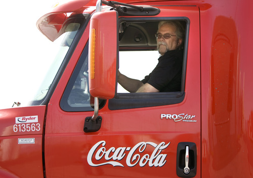 Kim Raff  |  The Salt Lake Tribune
Craig Vorwaller, a Ryder truck driver for Swire CocaCola, checks his side mirrors while hooking up a trailer to his truck before heading out on a transport in West Valley City on April 25, 2013. Vorwaller has been recognized by Ryder for driving 3.1 million miles over his 34-year professional driving career.