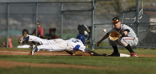 Scott Sommerdorf   |  The Salt Lake Tribune
Bingham's Aaron Marsh dives back in to first base on a pick off attempt during the Miner's loss to American Fork. American Fork defeated Bingham 8-7 in eight innings at Bingham, Friday, April 26, 2013.