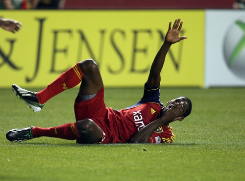 Kim Raff  |  The Salt Lake Tribune
Real Salt Lake forward Olmes Garcia (13) rolls on the ground after catching a shoulder in the face during a game against the Los Angeles Galaxy at Rio Tinto in Sandy on April 27, 2013. Real Salt Lake lost the game 2-0.