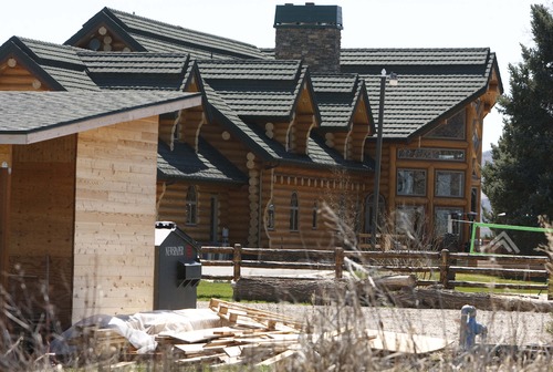 Leah Hogsten  |  The Salt Lake Tribune
April 12, 2013-Some neighbors believe the large log home on Stringtown Road in Eden, rented by The Summit Group, is operating as a business, and it is locally referred to as "the party house."  Eden residents say daily auto traffic has increased more than three times what it was previously, making the country road an unsafe place for the Valley Elementary school children who walk the road and the others who live on the road and ride their bikes after school. The Summit Group, led by four 20-something entrepreneurs, purchased Powder Mountain ski resort for $40 million with plans to develop 500 homes around a village on the resort's east side.