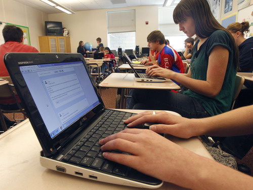 Al Hartmann  |  The Salt Lake Tribune
North Davis Junior High School ninth-graders work online on their computer notebooks researching Mahatma Gandhi in a geography class project.