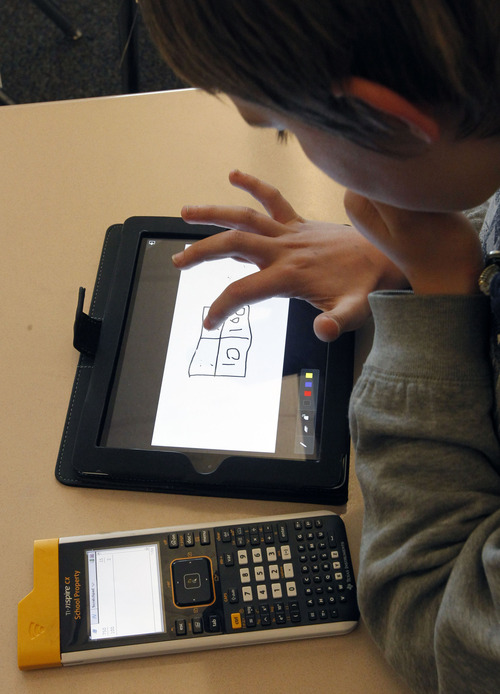 Al Hartmann  |  The Salt Lake Tribune
North Davis Junior High School seventh-graders work out a math problem on their iPads.