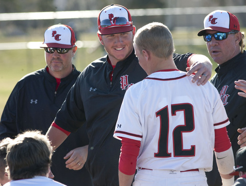 Steve Griffin | The Salt Lake Tribune

Park City head coach Lou Green hugs Time Leary as he talks with his team following a tough loss to Juan Diego at Park City High School in Park City, Utah Wednesday April 24, 2013.