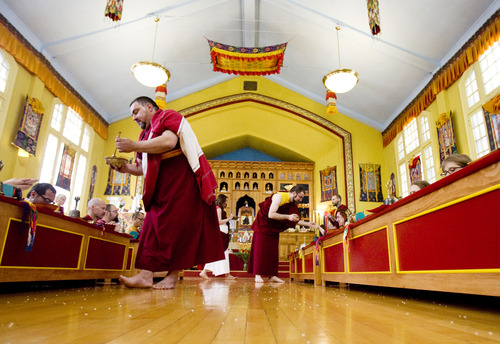 Kim Raff  |  The Salt Lake Tribune
Members of the Urgyen Samten Ling Buddhist temple practice rituals during a ceremony in the temple in Salt Lake City on April 21, 2013. The building was once a Mormon ward and a gothic nightclub before it was renovated and became a Buddhist temple.