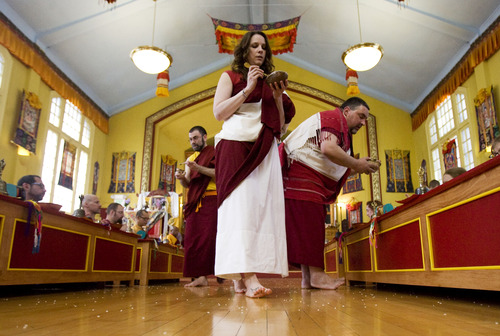 Kim Raff  |  The Salt Lake Tribune
Members of the Urgyen Samten Ling Buddhist temple practice rituals during a ceremony in the temple in Salt Lake City on April 21, 2013. The building was once a Mormon ward and a gothic nightclub before it was renovated and became a Buddhist temple.