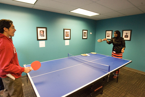 Paul Fraughton  |  The Salt Lake Tribune
Miguel Trujillo, left, and Najma Sharif play ping pong in the youth area of the new Hartland Partnership Center at 1578 W. 1700 South.
