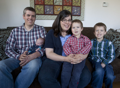 Steve Griffin | The Salt Lake Tribune

 Jonathan and Megan Richardson with their boys, Charlie, newborn, Henry, 3, and Walter, 5, in their West Valley City, Utah home Wednesday May 1, 2013.