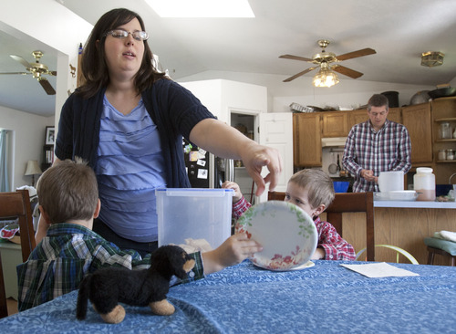 Steve Griffin | The Salt Lake Tribune

 Megan and Jonathan Richardson make dinner for their family in their West Valley City, Utah home Wednesday May 1, 2013. The Richardsons have three boys, Charlie, a newborn, Henry, 3, and Walter, 5.