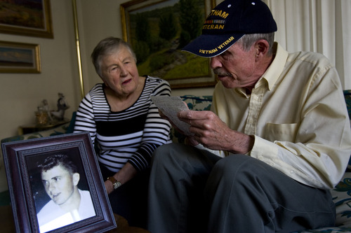 Kim Raff  |  The Salt Lake Tribune
(middle) Alice Telford listens as (right) Bill Gillingham reads a letter he wrote to her son (pictured left), John W. Telford, in 2007 on the 40th anniversary of his death. Telford lost her son, John, in the Vietnam War.  Bill Gillingham, John's old friend and a Vietnam veteran, contacted Alice Telford after he saw her in the Salt Lake Tribune back in February. He'd tried to find her since learning of John's death many years ago.