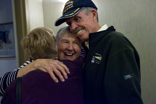 Kim Raff  |  The Salt Lake Tribune
(middle) Alice Telford greets (left) Lidia and (right) Bill Gillingham for the first time at her front door in Salt Lake City. Telford lost her son, John W. Telford, in the Vietnam War. Bill Gillingham, John's old friend and a Vietnam veteran, contacted Alice Telford after he saw her in the Salt Lake Tribune back in February. He'd tried to find her since learning of John's death many years ago.