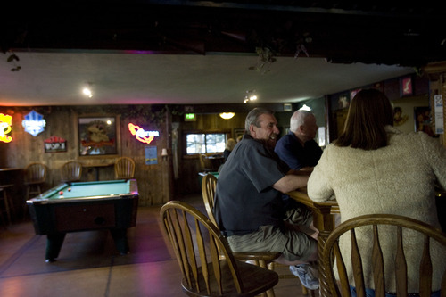 Kim Raff  |  The Salt Lake Tribune
People sitting at the bar drink and talk with each other inside The Hog Wallow Pub in Salt Lake City on April 26, 2013.  The bar also features two pool tables.