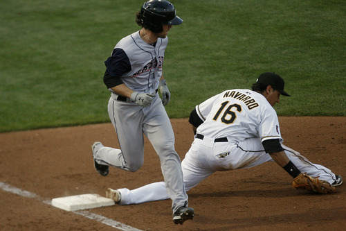 Chris Detrick  |  The Salt Lake Tribune
Salt Lake Bees' Efren Navarro (16) gets out Colorado Springs' Charlie Culberson (15) at first base during the game at Spring Mobile Ballpark Thursday May 2, 2013.