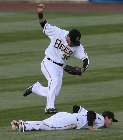 Steve Griffin | The Salt Lake Tribune

Bees outfielder Roberto Lopez, top, leaps over Bees shortstop Jimmy Swift as he makes the catch on a short fly ball during the Bees versus Sky Sox baseball game at Spring Mobile Ballpark in Salt Lake City, Utah Wednesday May 1, 2013. Swift laid his body flat on the ground after Lopez called for the fly ball. Lopez made the catch and jumped over Swift, in the same motion avoiding a collision.