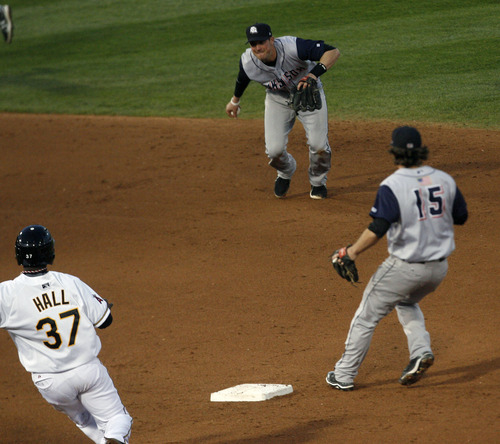 Chris Detrick  |  The Salt Lake Tribune
Salt Lake Bees' Bill Hall (37) runs safely to second base past Colorado Springs' Tommy Manzella (4) during the game at Spring Mobile Ballpark Thursday May 2, 2013.