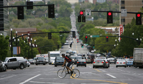 Francisco Kjolseth  |  The Salt Lake Tribune
Bicyclists make their way through down town traffic on Monday, April 30, 2012. In 2012, Salt Lake City issued fewer citations to bicyclists than in the prior five years.