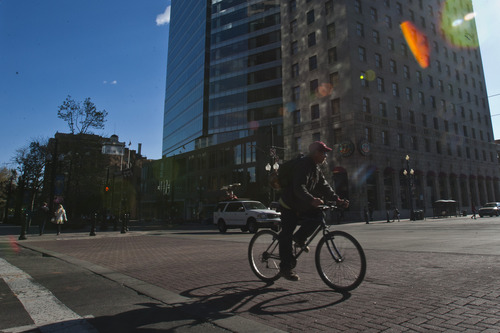 Chris Detrick  |  The Salt Lake Tribune
A biker rides around downtown Salt Lake City Wednesday May 1, 2013.