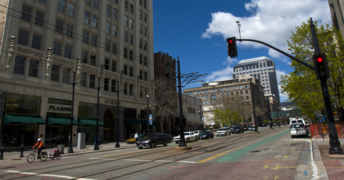 Chris Detrick  |  The Salt Lake Tribune
A biker rides through a red light in downtown Salt Lake City Wednesday May 1, 2013.