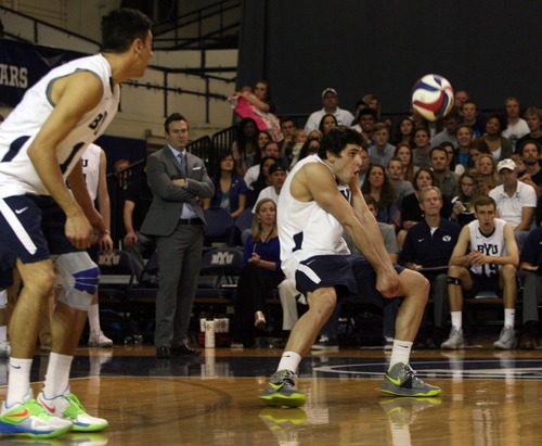 Kim Raff  |  The Salt Lake Tribune
As BYU coach Chris McGown looks on (middle) BYU player Josue Rivera bumps the ball after a UCLA serve during the semifinals of the MPSF Volleyball Tournament at the Smith Fieldhouse in Prove on April 25, 2013.  BYU went on to win the match 3-2 after trailing UCLA by two sets.
