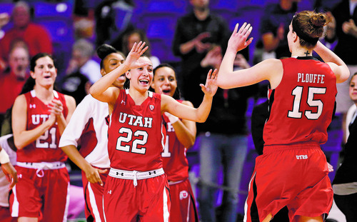 Utah players celebrate after defeating Kansas State in a women's NIT college basketball semifinal, Wednesday, April 3, 2013, in Manhattan, Kan. Utah won 54-46 in overtime. (AP Photo/Charlie Riedel)